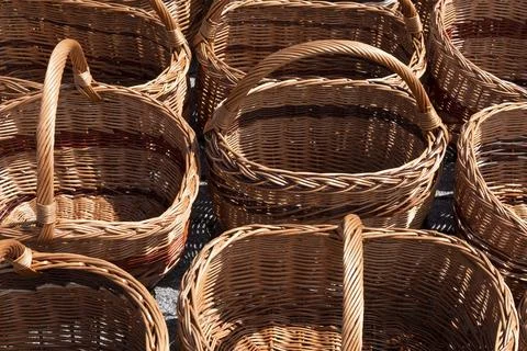 Empty Wicker Baskets with handle on market. Harvest season concept Photos