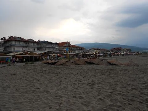 Empty wide sandy beach at dusk Stock Photos