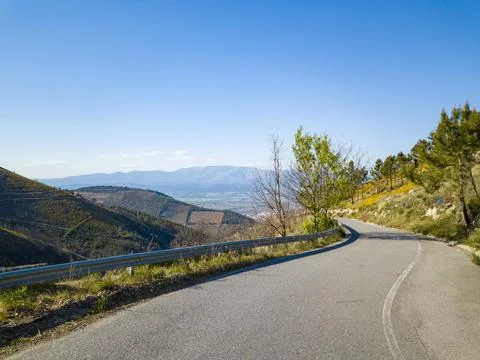 Empty winding road in the mountains in the interior of Portugal. Stock Photos