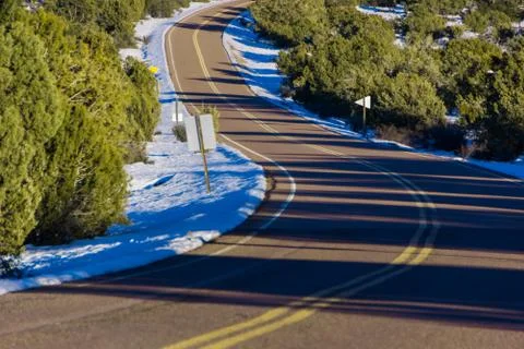 Empty Winding Snowy road Stock Photos
