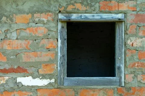 An empty window in a brick wall Stock Photos