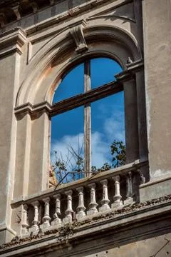 Empty window without glass on facade with sky behind it Stock Photos