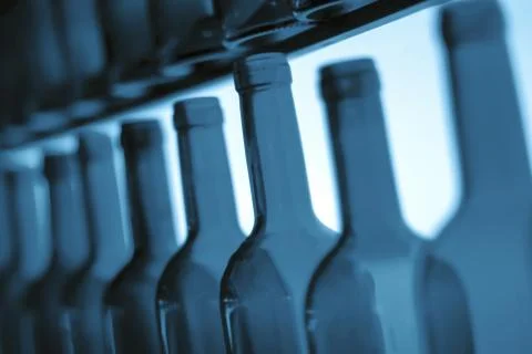 Empty wine bottle necks in a row as illustration of binge or problem drinking Stock-Fotos