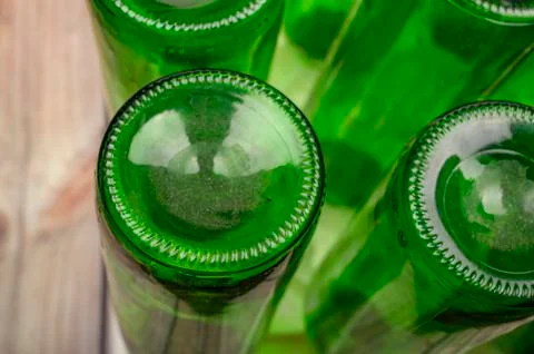 Empty wine bottles in a plastic dryer on the table. Close up. Stock Photos