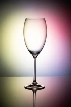 Empty wine glass goblets on a colored background abstract Fotos de archivo