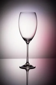 Empty wine glass goblets on a colored purple background abstract Stock-Fotos