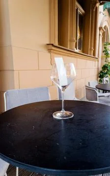 Empty wine glass stands on table Stock Photos