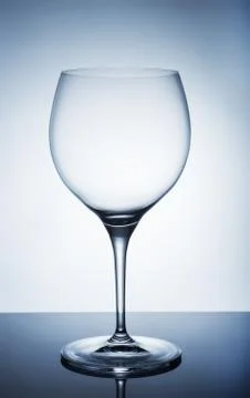 An empty wine glass on a white background Photos