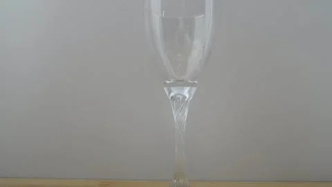 An empty wine glass on a wooden table. Stock Footage 151200818