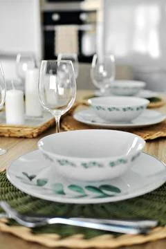 Empty wine glasses and dinnerware is ready for lunch served on dining table,  Stock Photos