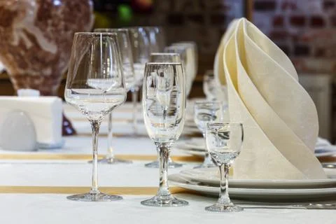 Empty wine glasses are on the table in the restaurant Stock Photos