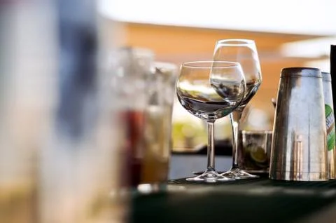Empty wine glasses on the bar. Stock Photos