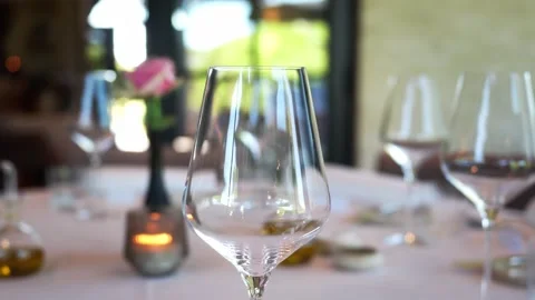 Empty wine glasses on beautiful decorated dining table close up inside Stock Footage 335387629