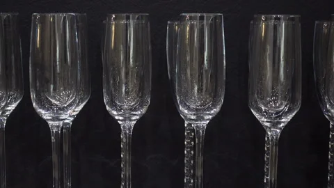 Empty wine glasses on a black Stock Footage 128354937