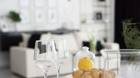 Empty wine glasses on blurred background of modern interior Stock Photos