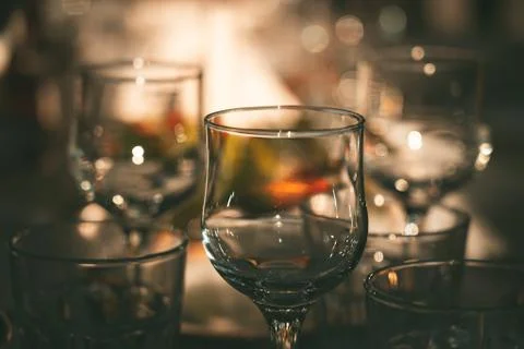 Empty wine glasses on dinner table in restaurant Stock Photos
