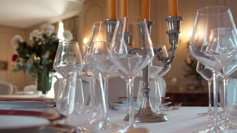 Empty wine glasses on festive dinner table Stock Footage 332304338