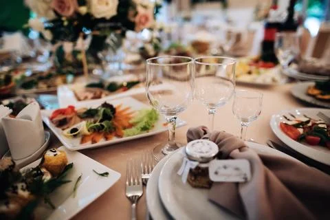 Empty wine glasses on the holiday table. Table with food Stock Photos