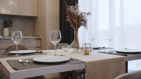 Empty wine glasses on the kitchen table Video stock 168581413