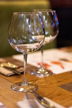 Empty wine Glasses in the restaurant setting. Stock Photos