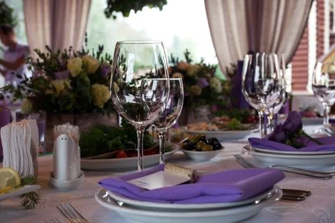 Empty wine glasses set in restaurant Stock Photos