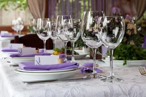 Empty wine glasses set in restaurant Stock Photos
