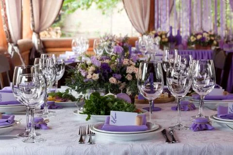 Empty wine glasses set in restaurant for wedding Stock Photos