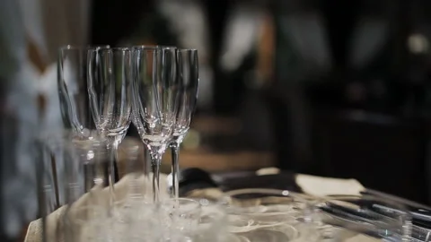 Empty wine glasses standing on a tray in the restaurant close-up. Stock Footage 111805768