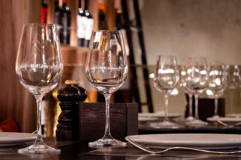 Empty wine glasses on a table at a fancy restaurant Foto stock