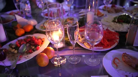 Empty wine glasses on the table with food Stock Footage 156330613