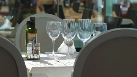 Empty wine glasses on a table in a restaurant in 4k slow motion 60fps Stock Footage 142314359
