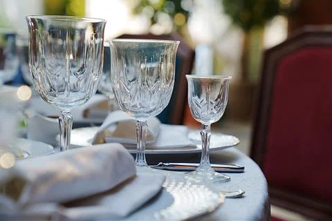 Empty wine glasses on the table.table setting for a festive dinner. Stock Photos