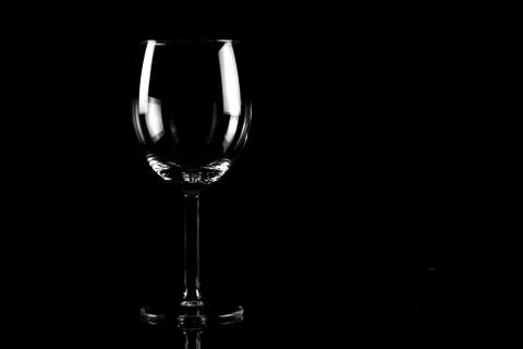 Empty wineglass on black background Stock Photos