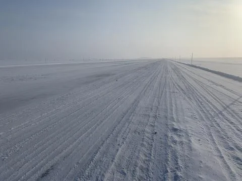 An empty winter road Stock Photos