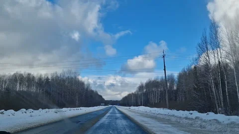 An empty winter road surrounded by snowdrifts. Stock Footage 299977085