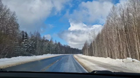An empty winter road surrounded by snowdrifts. Stock Footage 299977286