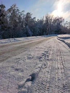 Empty winter road with tire tracks Stock Photos