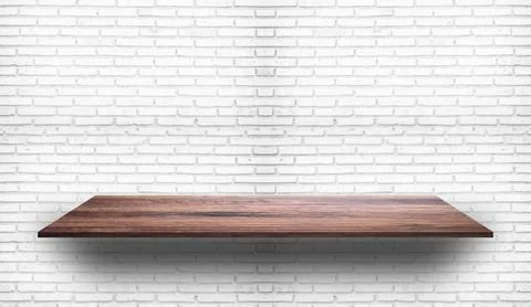Empty wood plank shelf at white brick wall pattern background. Design for pro Stock Photos