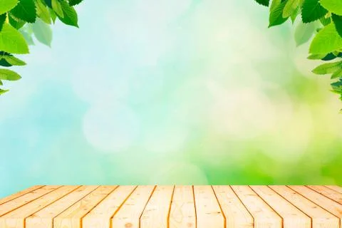 Empty wood plank table top with blur park green nature background bokeh light Stock Photos