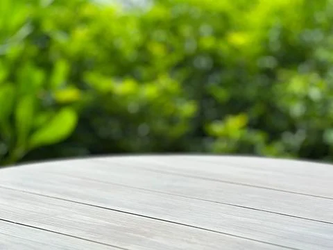 Empty wood plank table top with blur green nature background bokeh light,Mo.. Stock Photos