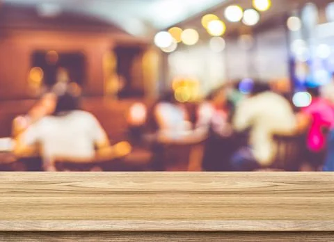 Empty wood table and blurred cafe light background. product display template. Stock Photos