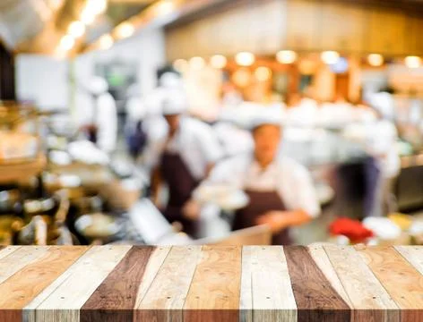Empty wood table and blurred restaurant light background. product display tem Stock Photos