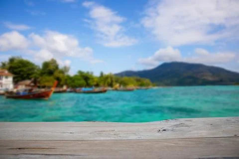 Empty wood table for present product with soft blur natural sea with mounta.. Stock Photos
