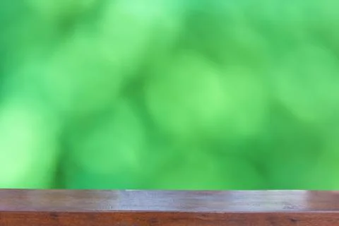 Empty wood table top on  Abstract Blurred green bokeh background Stock Photos