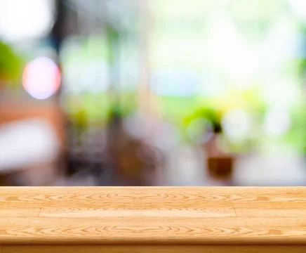 Empty wood table top with coffee shop blur with bokeh background,Product di.. Stock Photos