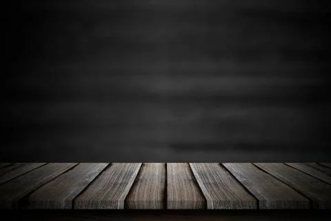 Empty wood table top over blur blackboard background. Stock Photos