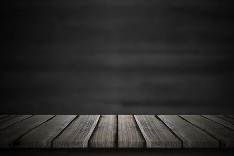 Empty wood table top over blur blackboard background. Stock Photos