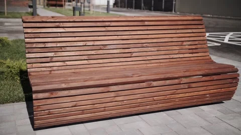 Empty wooden bench in the park Stock Footage 134385075