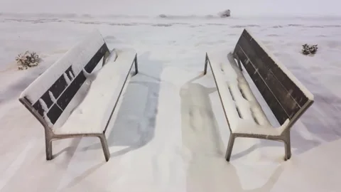 Empty Wooden Bench in Snowy Winter Park background Stock Footage 330167118