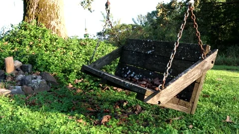 An empty wooden bench swing, 4K Stock Footage 158515170